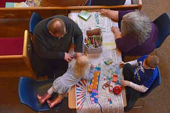 children coloring in worship